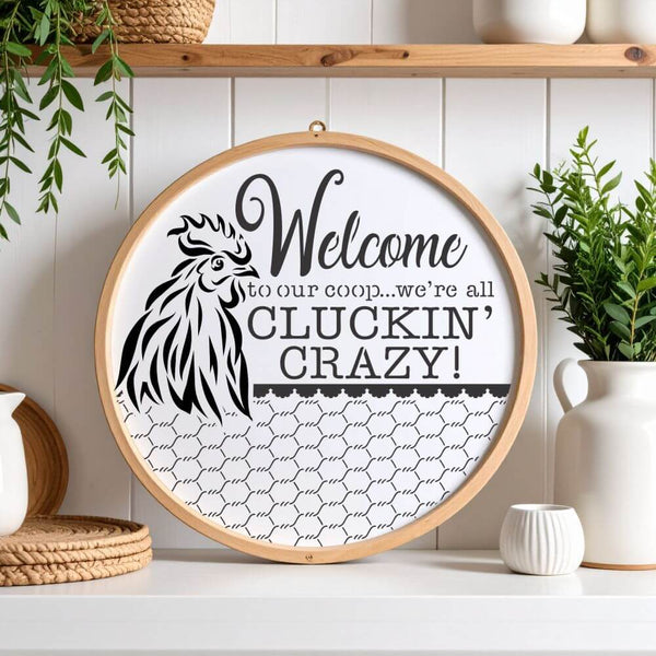 Round sign stencil displaying 'Welcome to our coop...we're all cluckin' crazy!' for decorative farmhouse décor.
