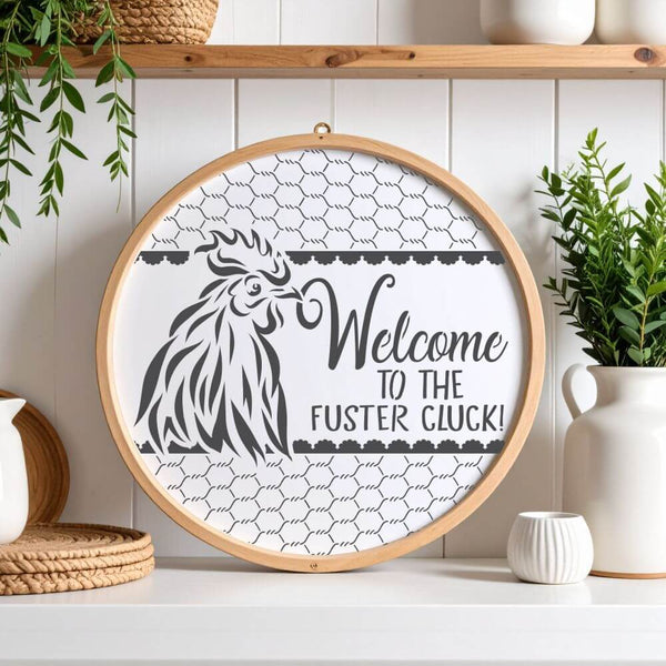 Decorative Round Sign Stencil featuring 'Welcome to the Fuster Cluck' for home décor and craft projects.