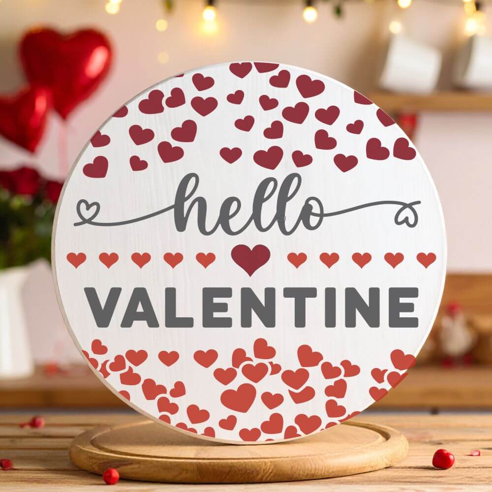 Decorative round sign stencil featuring "Hello Valentine" text and hearts for Valentine's Day décor.